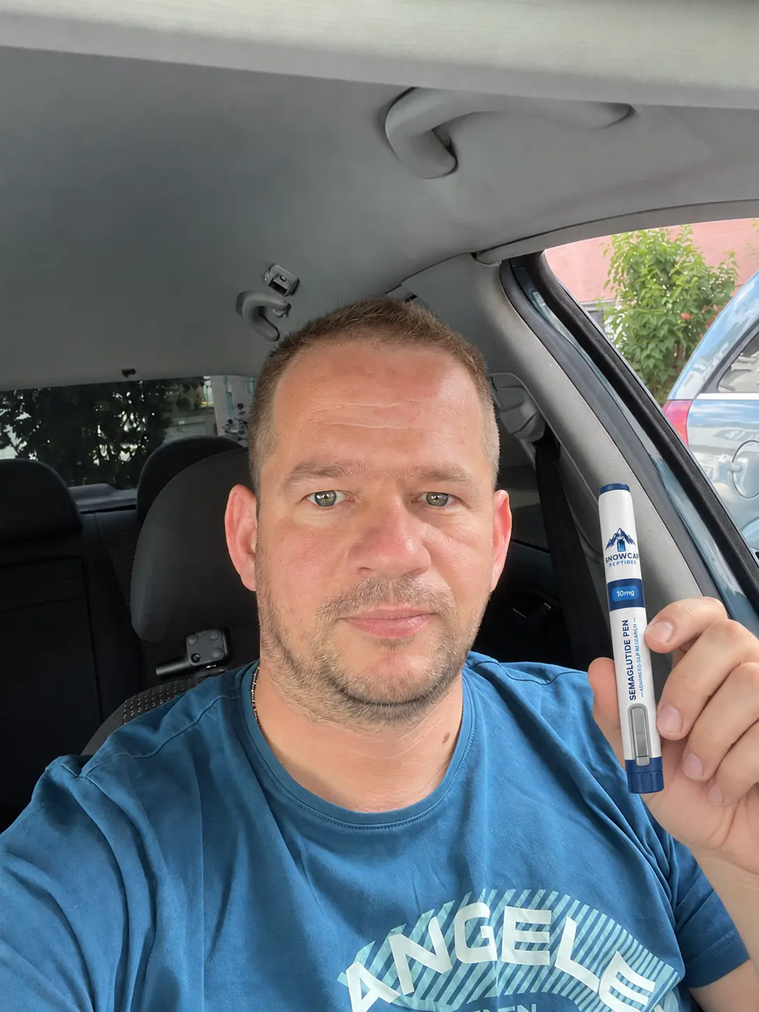 Man holding a Snowcap Semaglutide pen